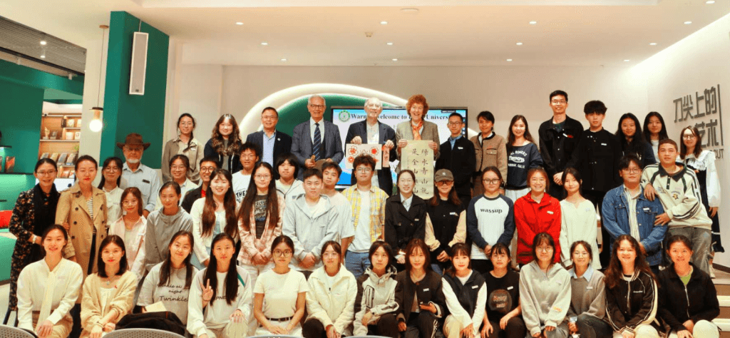 Vesselin, Zhihe Wang, John Grim, and Mary Evelyn Tucker with students at Pu'er University