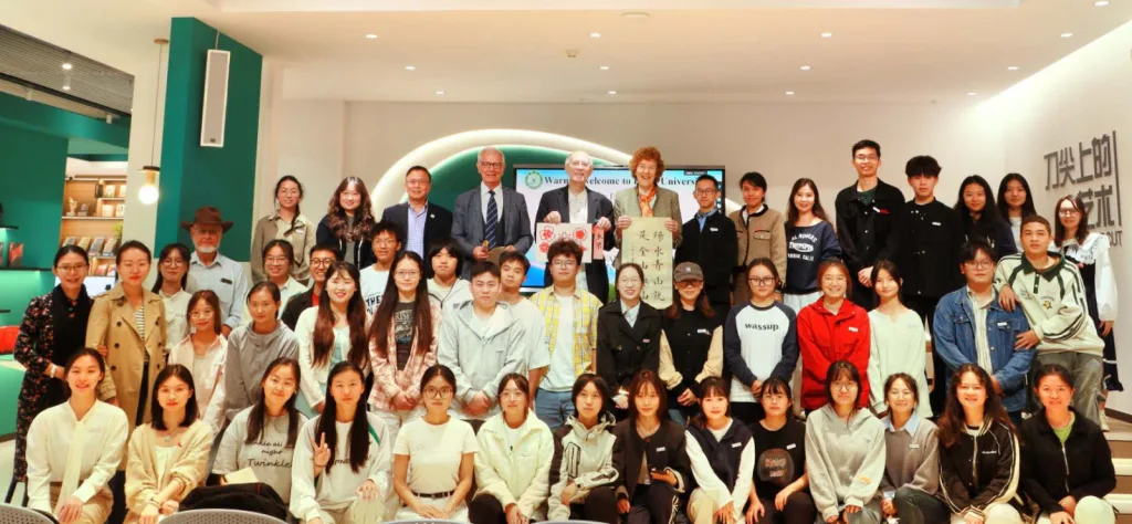 Vesselin, Zhihe Wang, John Grim, and Mary Evelyn Tucker with students at Pu'er University